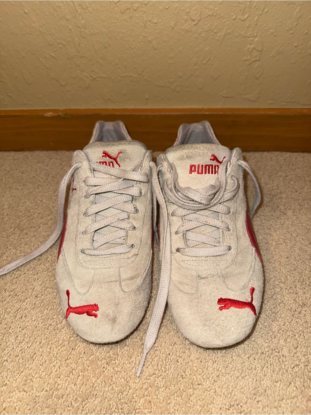 Women’s Puma Suede Sneakers with Red Accents
